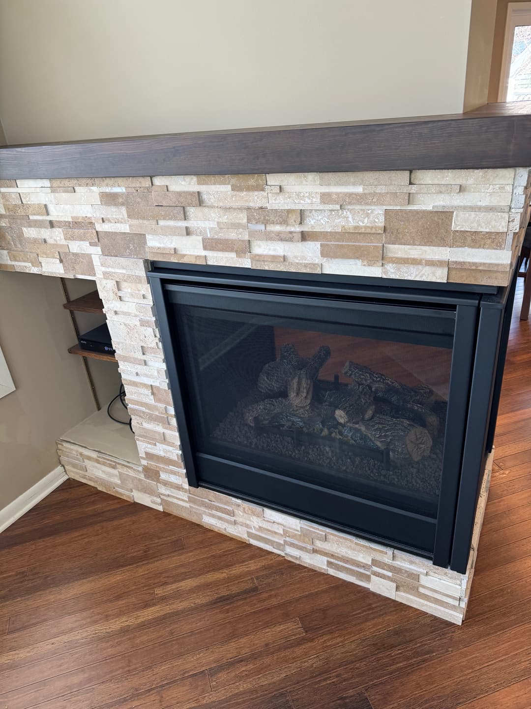 picture of a fireplace full of contemporary clean beige stonework 