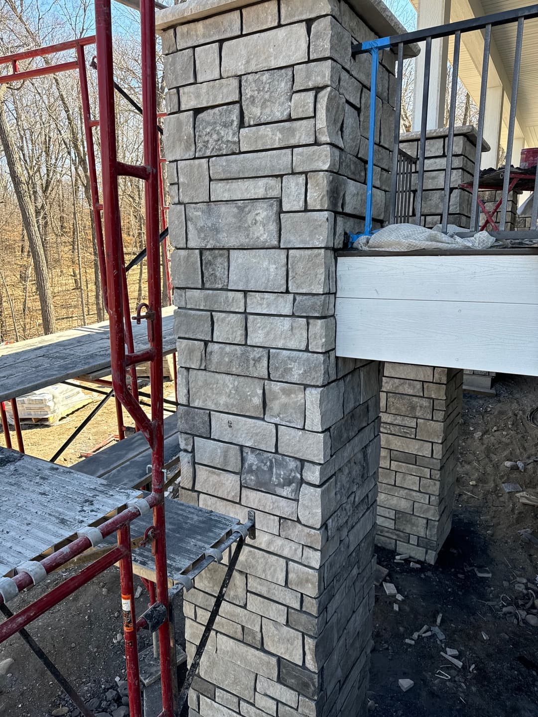 picture of deck structural stonework covering the deck studs